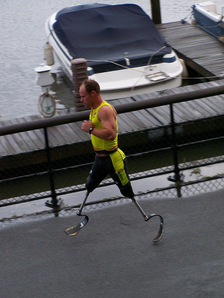 Para-athlete running on prosthetic blades