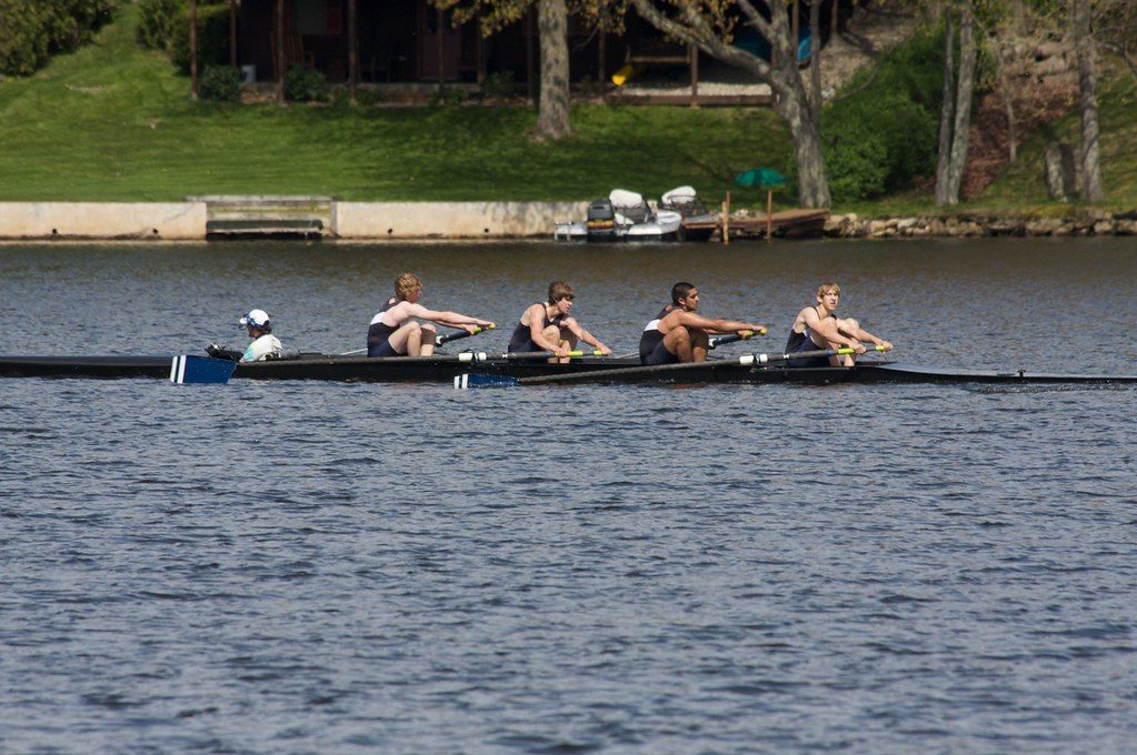 Rowing four on lake