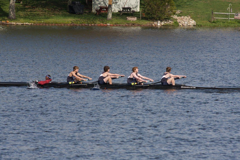Rowing four on lake