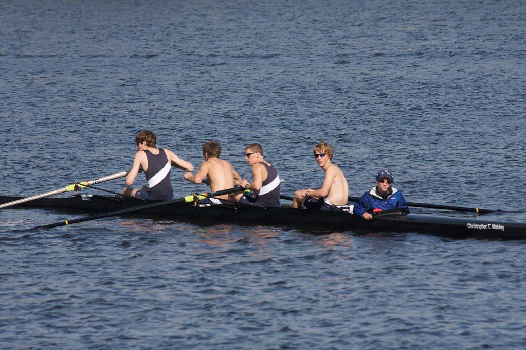 Rowing crew in a boat on water