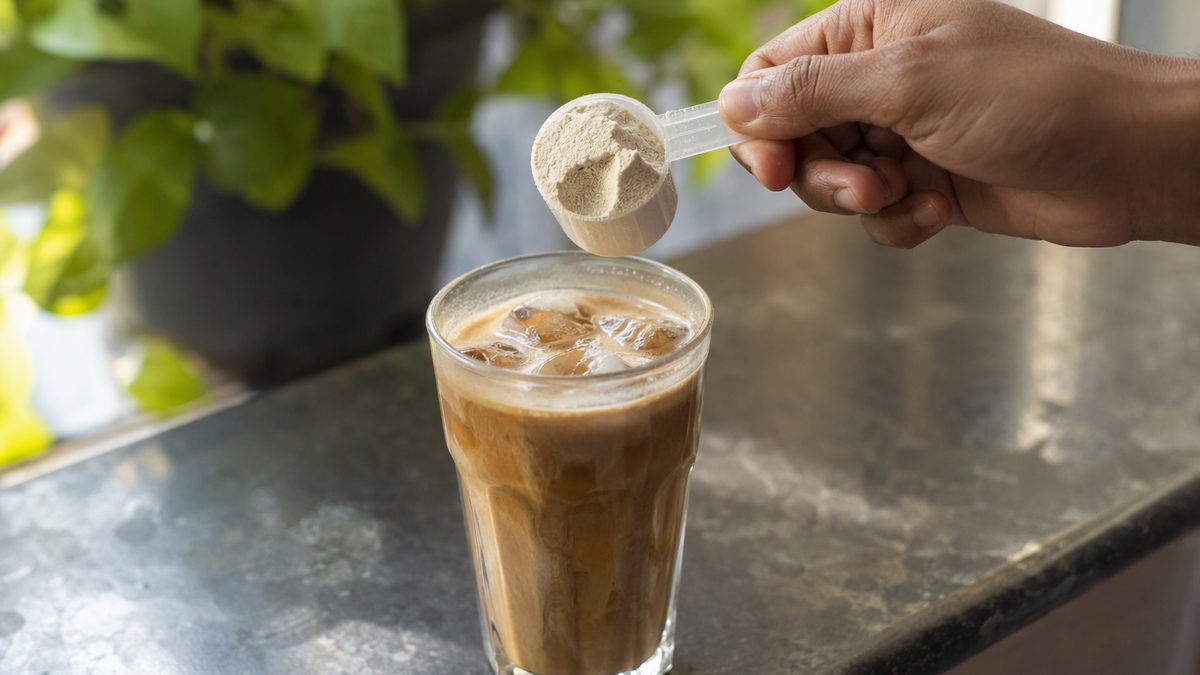 Iced coffee with protein shake scoop