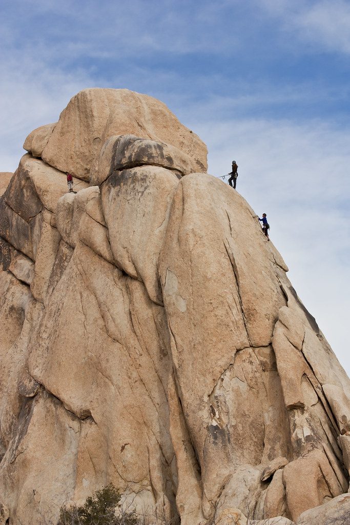 Climbers on large granite formation